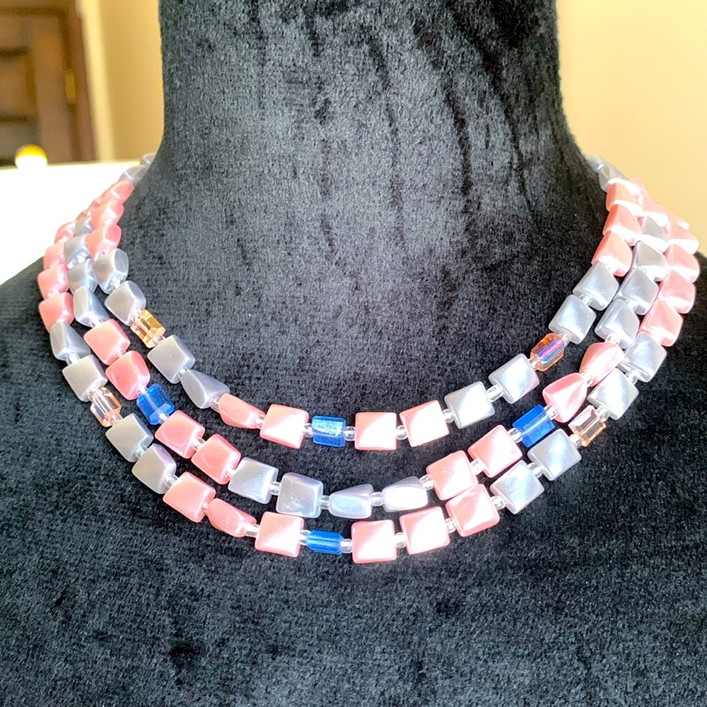Vintage Japan 3 strands necklace with matching clip on earrings.